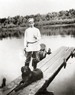 Сергей Рахманинов с собакой Левко на мостках у реки Хопёр близ имения Красненькое. 1899 год
